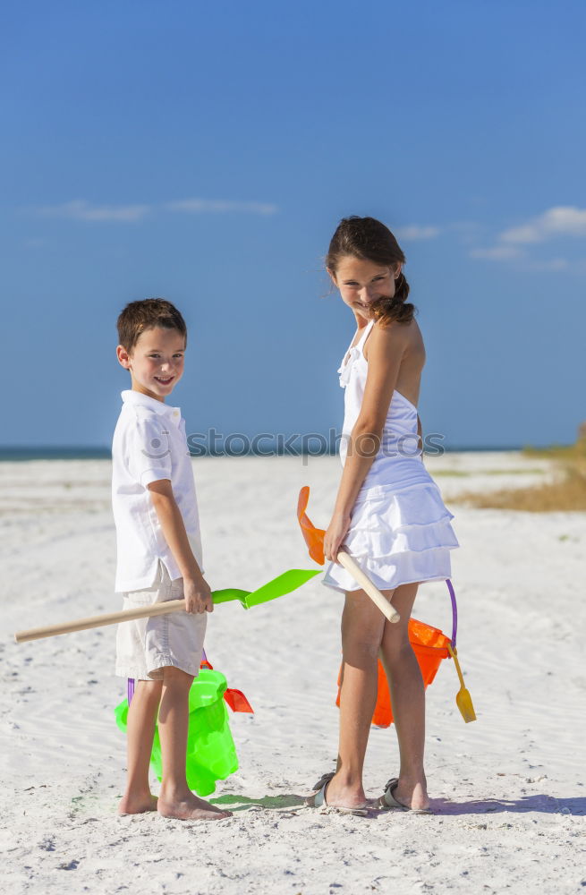 Similar – Image, Stock Photo Two happy children playing on the beach