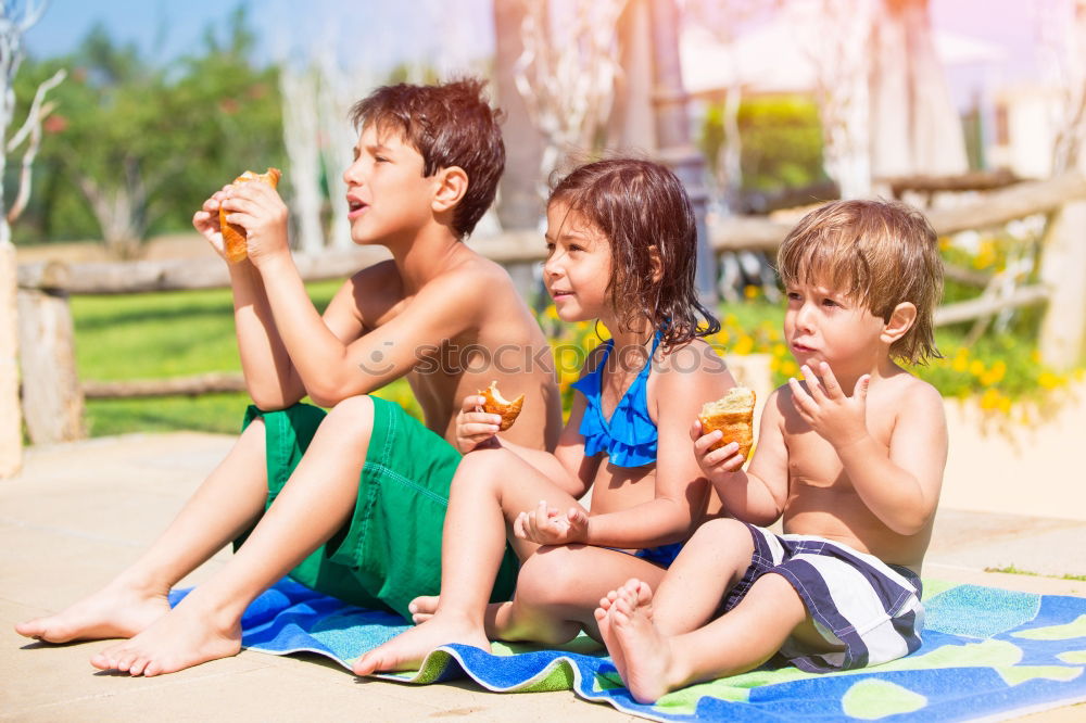 Similar – Image, Stock Photo Two happy children lie on a hammock and play with soap bubbles.