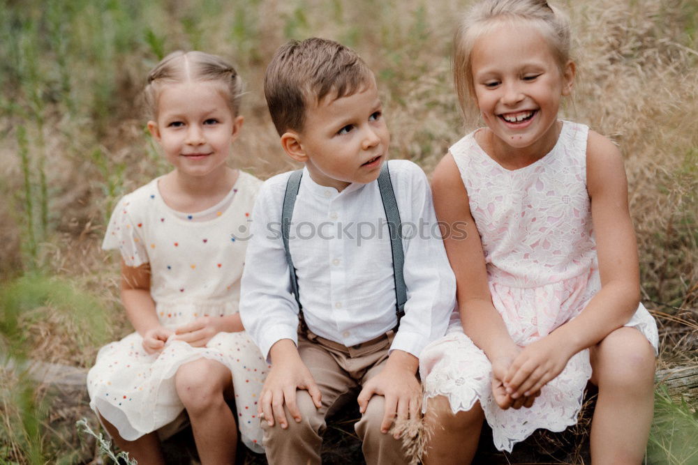 Similar – Image, Stock Photo Grandmother with her grandchildren sitting in the field