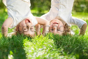 Similar – Image, Stock Photo Mother and daughter doing yoga exercises on grass in the park at the day time