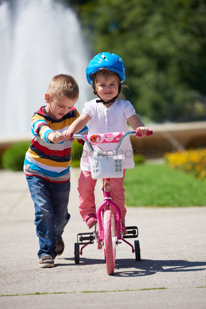 Similar – Image, Stock Photo Young boy pushing little sister in a baby stroller