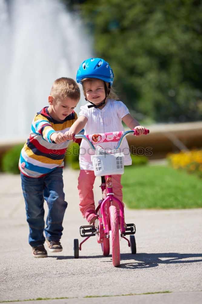 Similar – Image, Stock Photo Young boy pushing little sister in a baby stroller