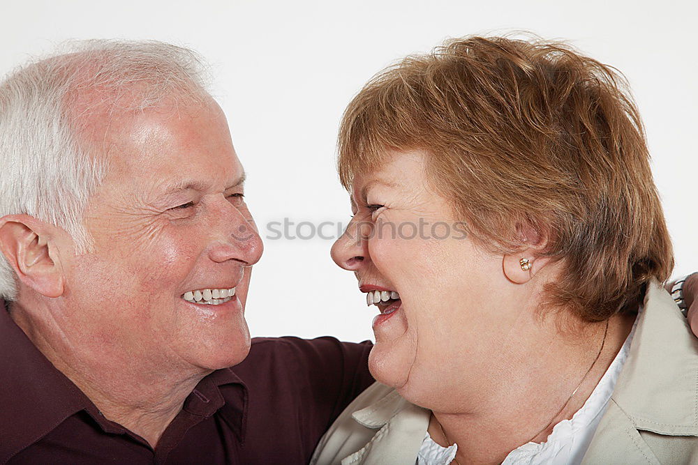 Similar – Smiling senior couple looks lovingly into each other’s eyes