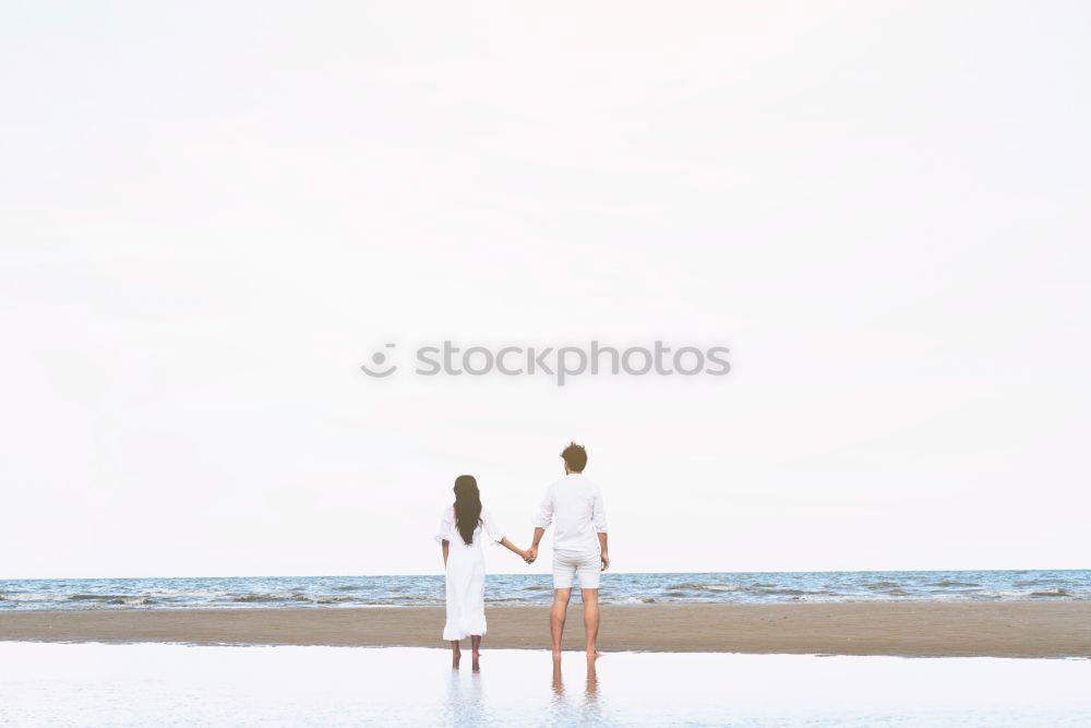 Happy children playing on the beach