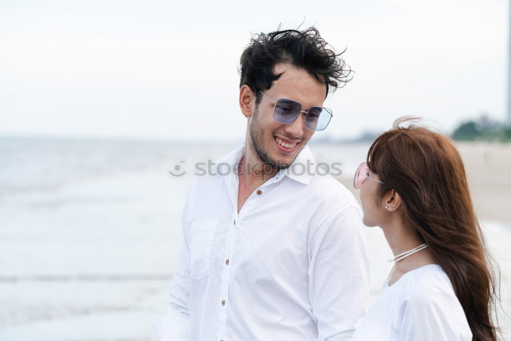 Similar – Image, Stock Photo Beautiful young couple hugging, looking at camera and smiling