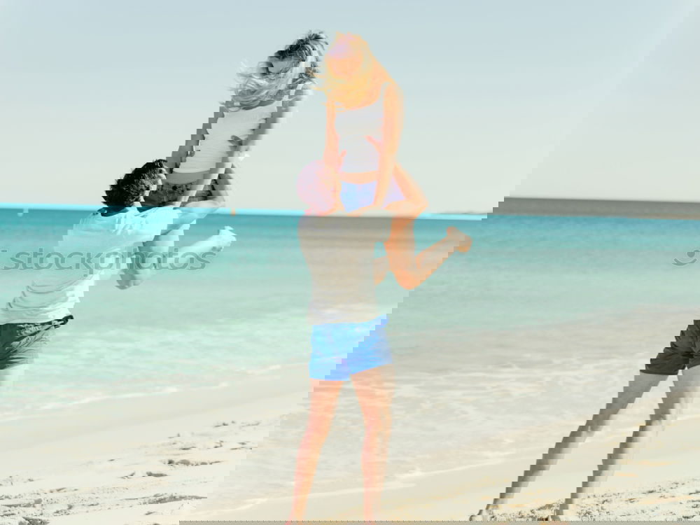 Similar – Image, Stock Photo Happy father and son playing on the beach at the day time. Concept of friendly family.