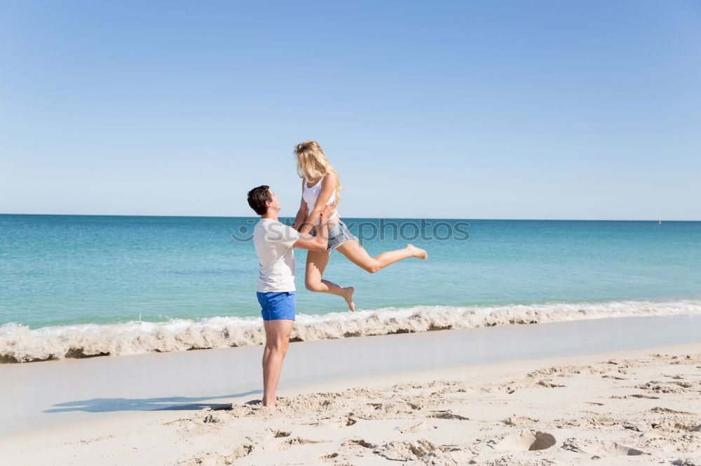 Similar – mother and sun having a walk at the beach