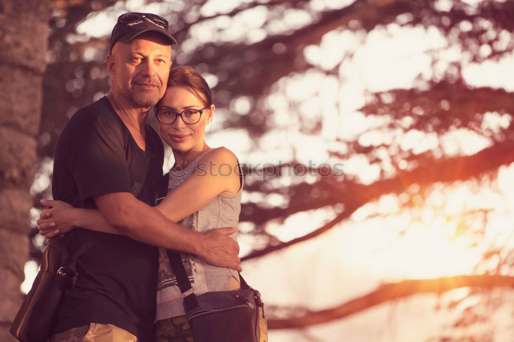 Similar – Image, Stock Photo Happy couple hugging and kissing near tree in park