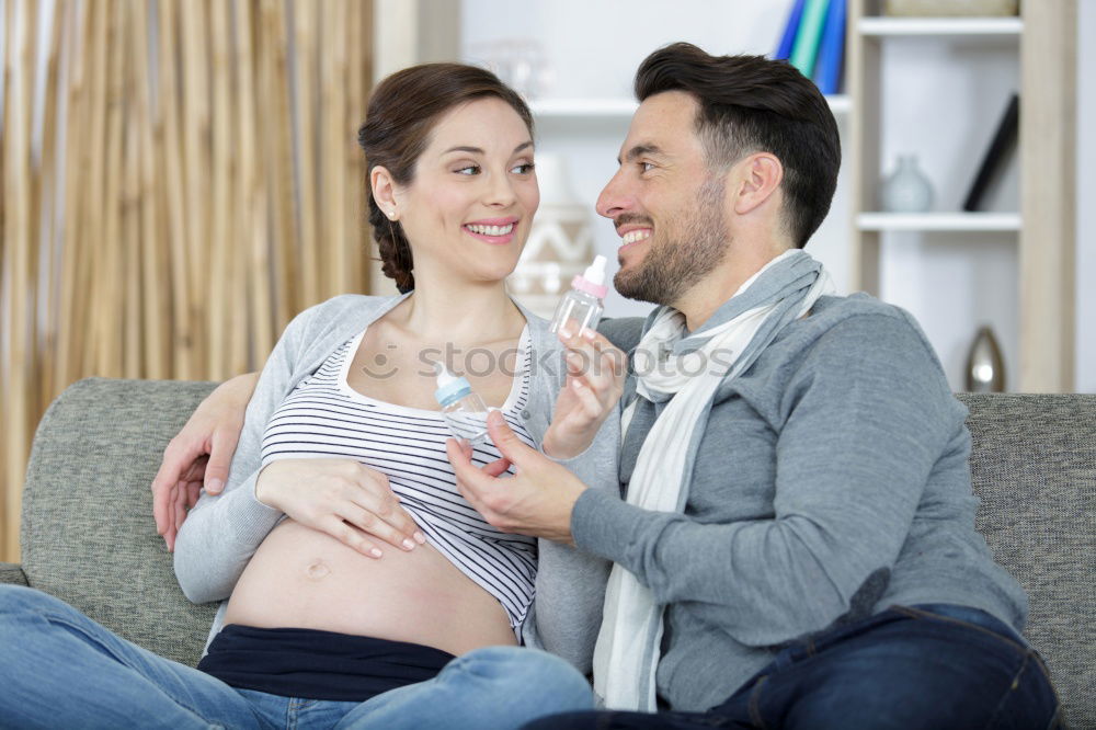 Similar – Image, Stock Photo Happy pregnant couple feeling the movements of their baby