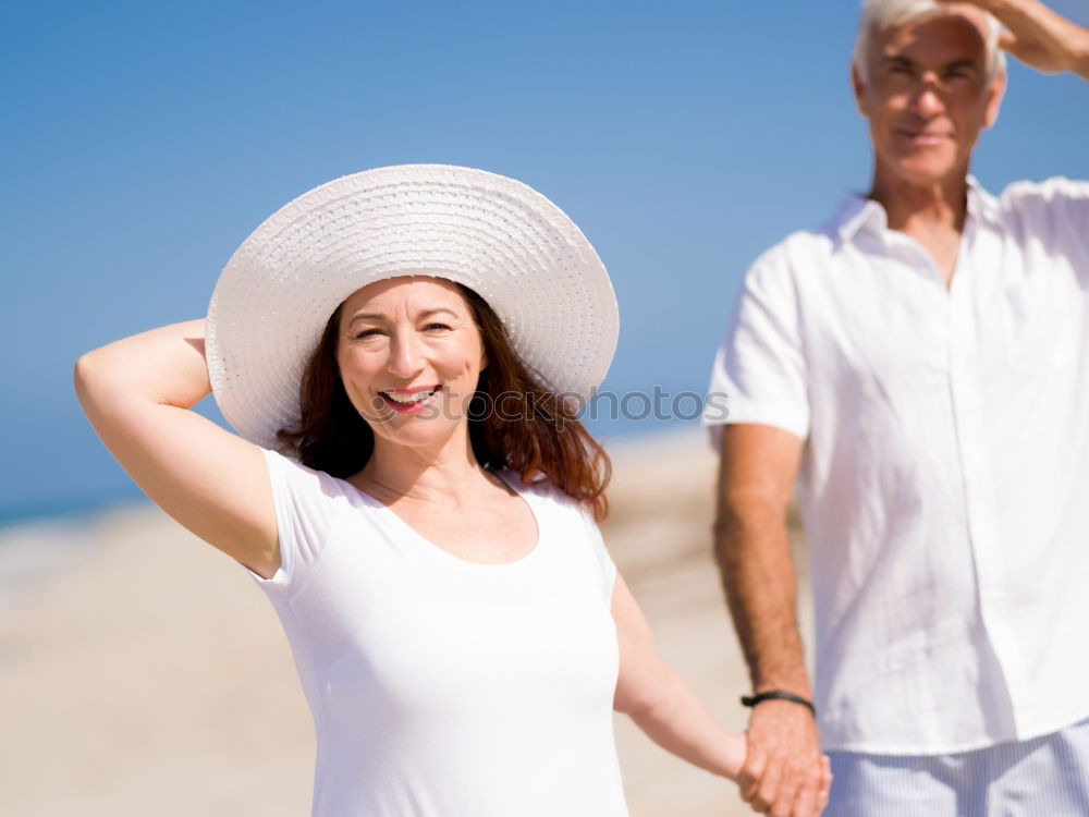 Similar – Happy young family of three at the beach