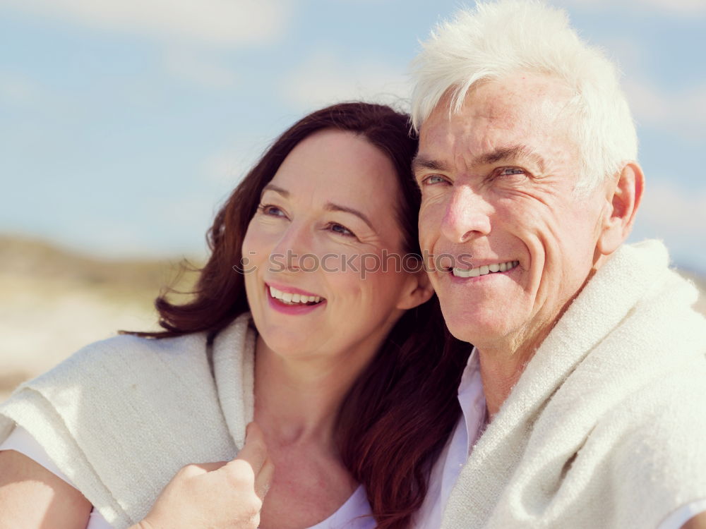 Similar – Senior man and woman having a run along the shore. Scene with sea, sand and trees. Healthy and active way of life