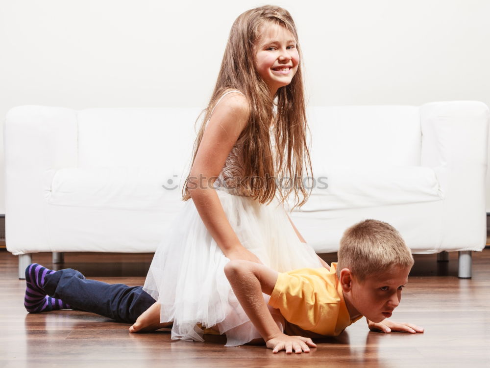 Similar – Two beautiful sisters playing on bed