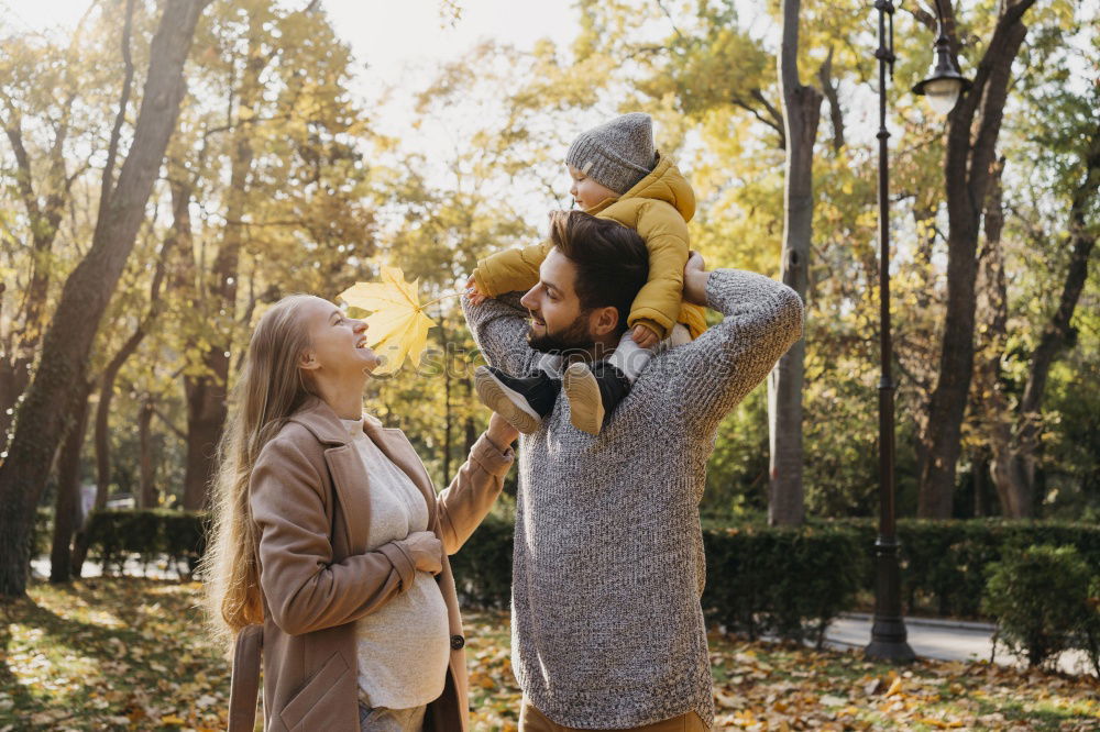 Similar – happy family: young mother walks with her child in the Park