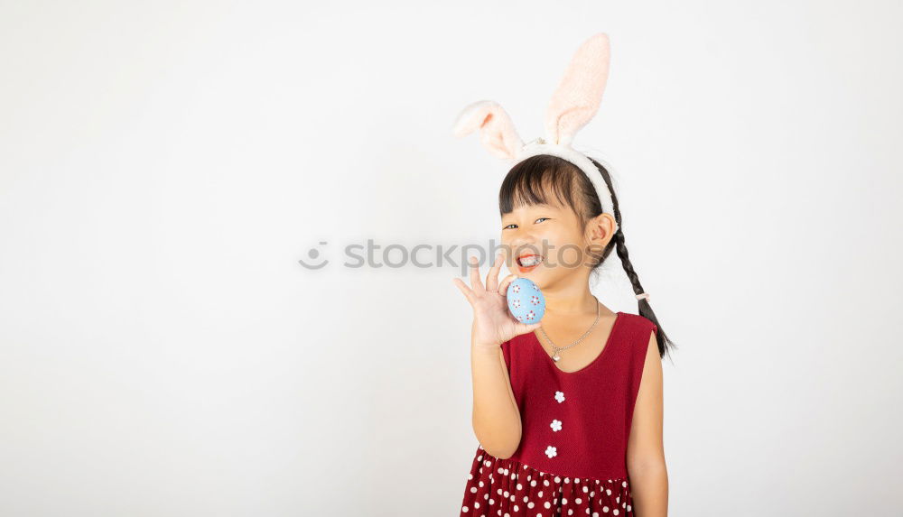 Similar – Back view of a young woman wearing rabbit ears