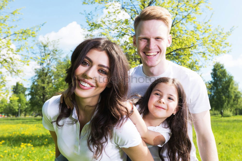 Similar – Image, Stock Photo Happy young family in a urban park.