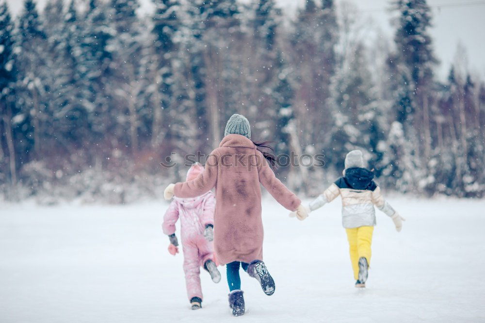 Similar – Mother and her daughter sitting on a bench on wintery day