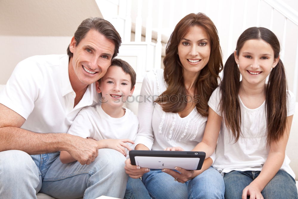 Similar – Happy family in a urban park playing with tablet computer