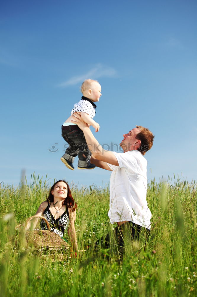 Similar – Father and son playing in the park at the day time.