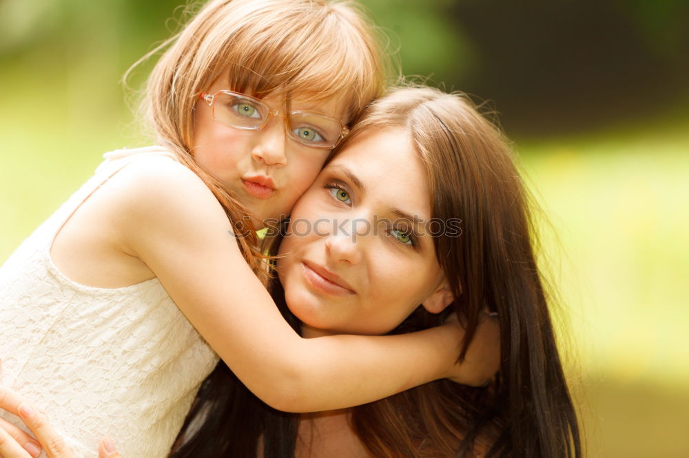 Happy mother and daughter playing in the park at the day time. Concept of celebration Mothers day .