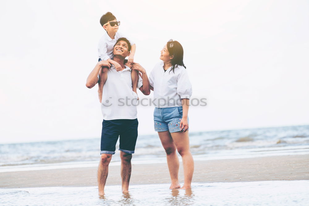 Similar – Father and son playing on the beach at the day time.