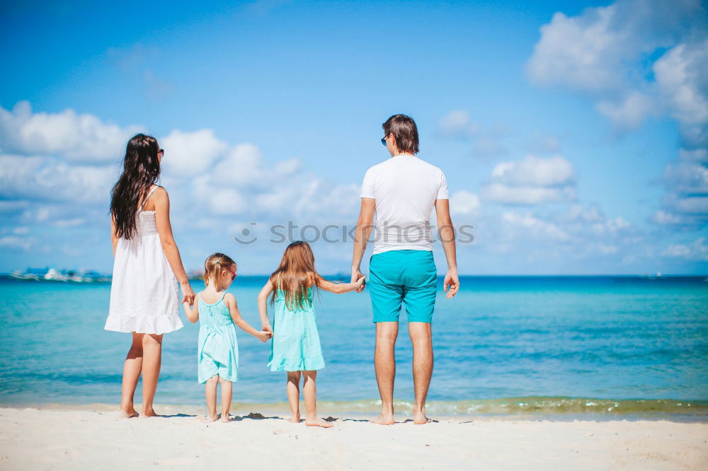 Similar – Mother and children playing on the beach at the day time. Concept of friendly family.