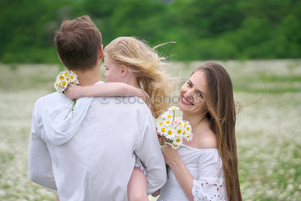 Similar – Grandmother with her grandchildren sitting in the field