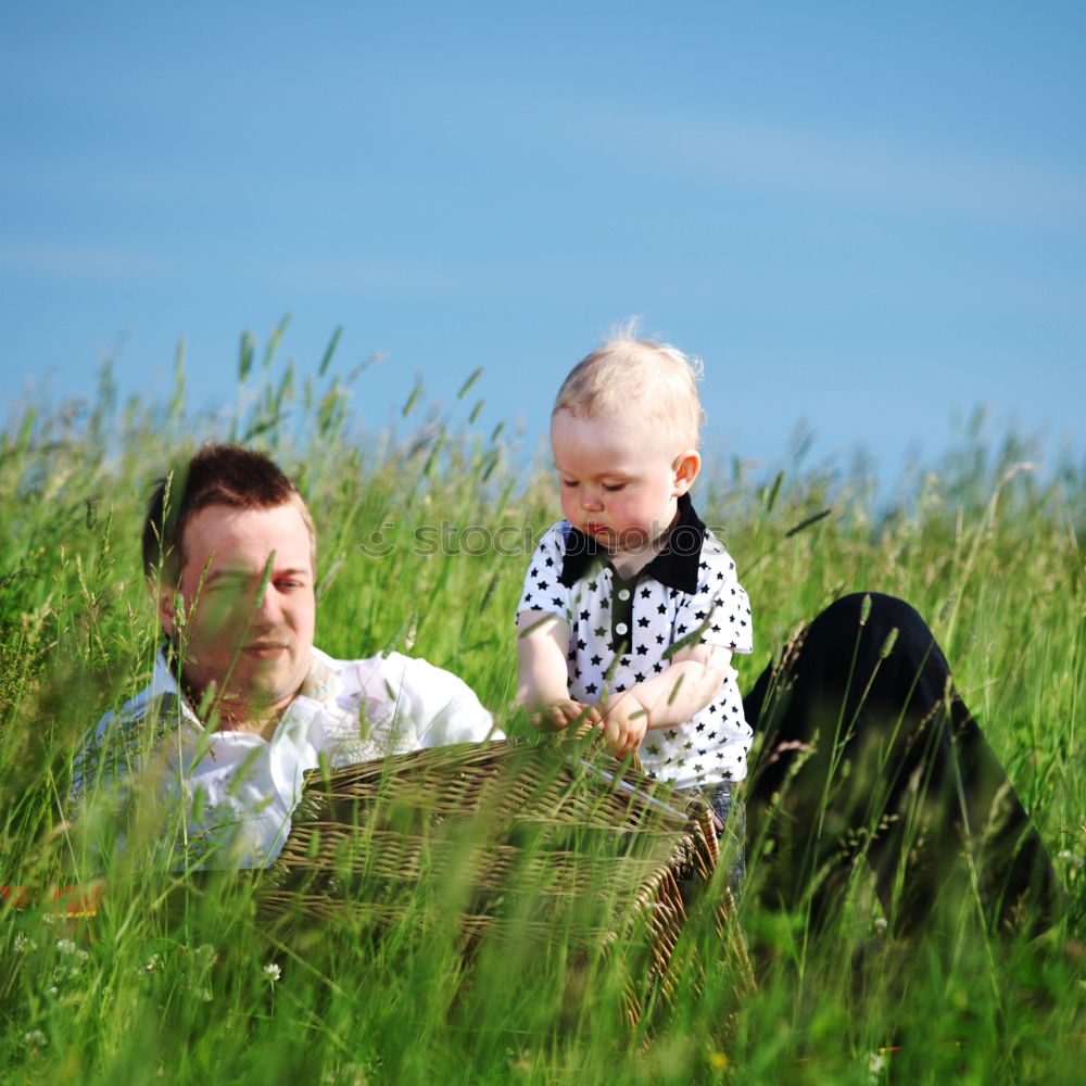 Similar – Granny sitting with her grandson on a meadow in nature