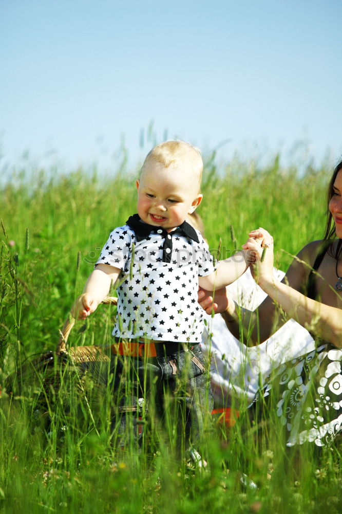 Similar – Image, Stock Photo Mother holding walking child