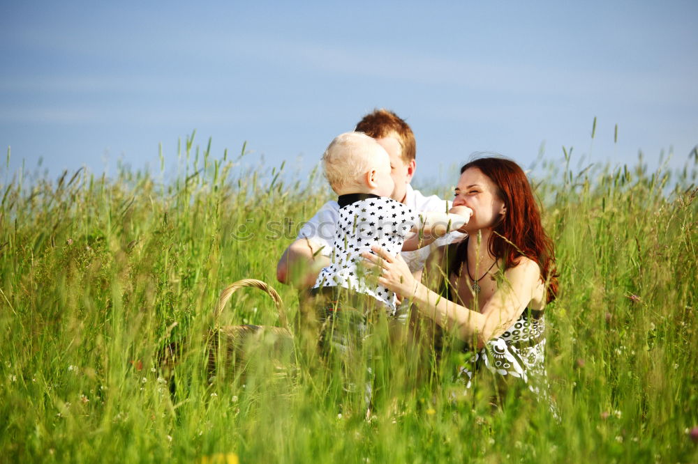 Similar – Woman with child on lawn