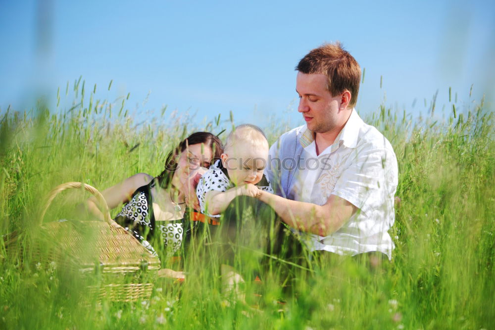 Similar – Image, Stock Photo Father showing grasshopper to children