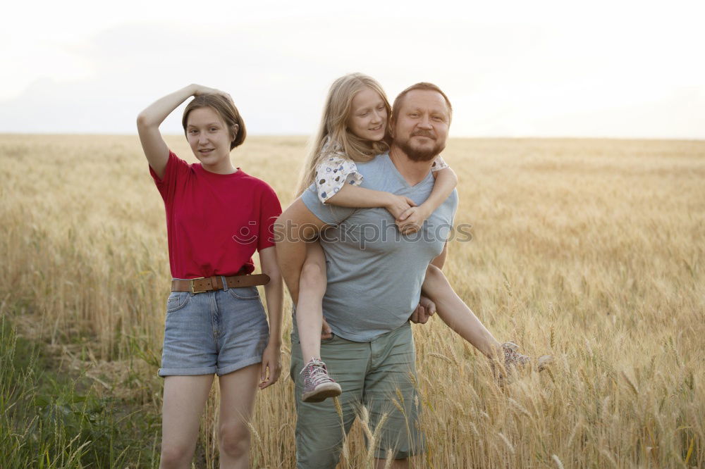 Similar – Image, Stock Photo happy father and daughter walking on summer meadow