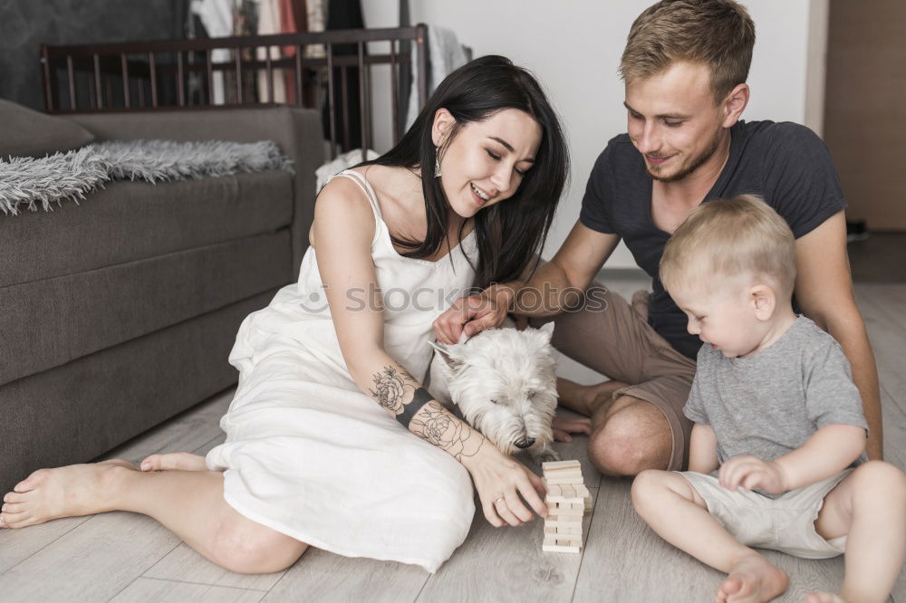 Similar – Couple relaxed at home in bed with their little daughter and the dog