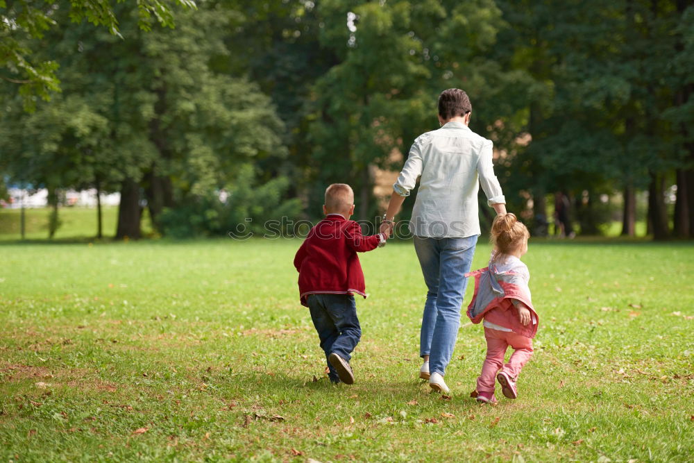 Similar – Children have fun running in nature