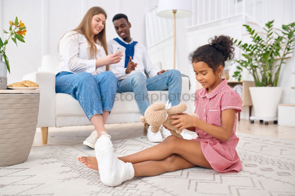 Similar – Image, Stock Photo Girl and boy reading a book sitting on the bed