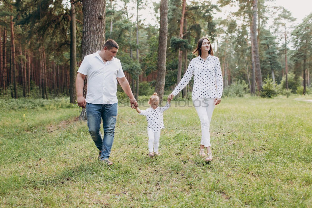 Similar – Image, Stock Photo Portrait of happy family enjoying together leisure over a wooden pathway into the forest