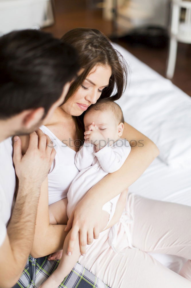 Similar – Image, Stock Photo happy young mother and her baby boy lying on bed and smiling