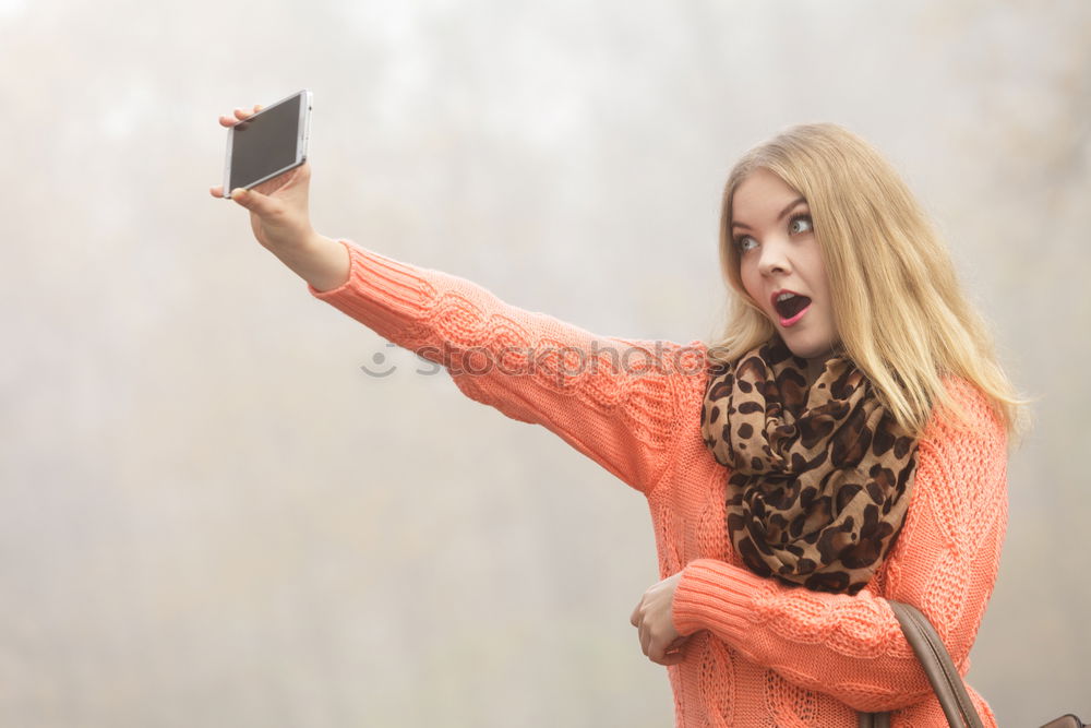 Similar – young woman with phone outdoors