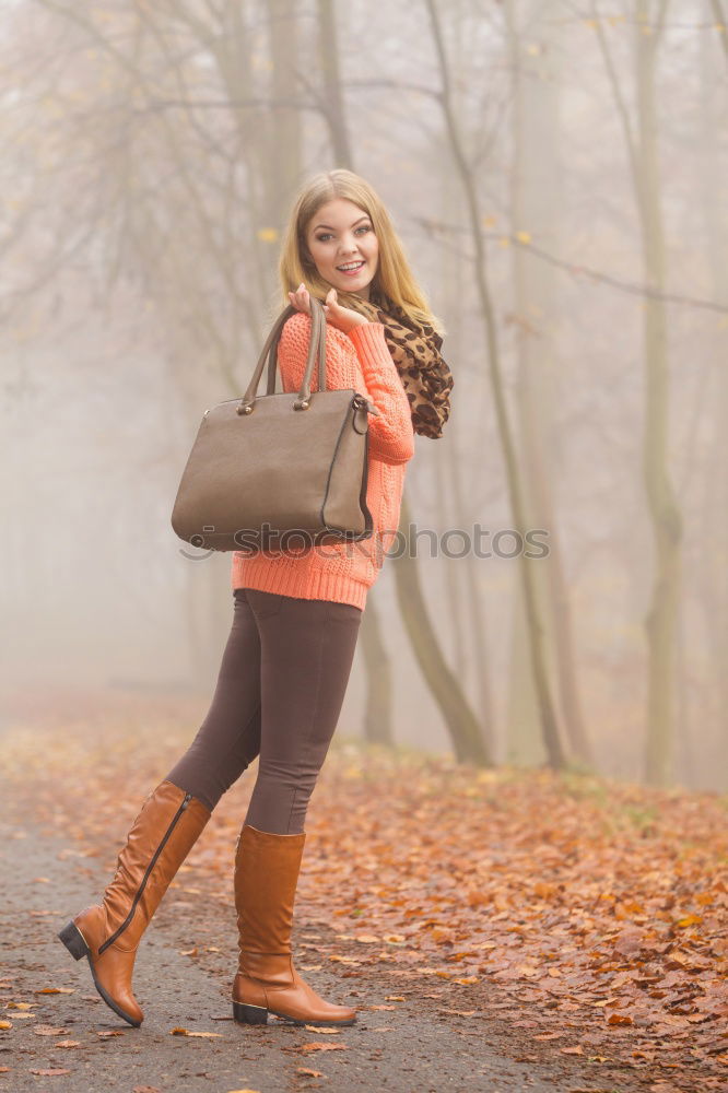 Similar – Young woman with moving hair wearing casual clothes