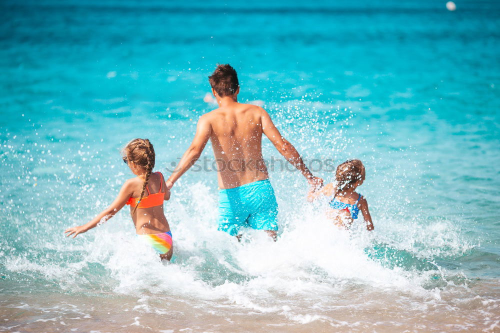 Similar – Mother and children playing on the beach at the day time. Concept of friendly family.