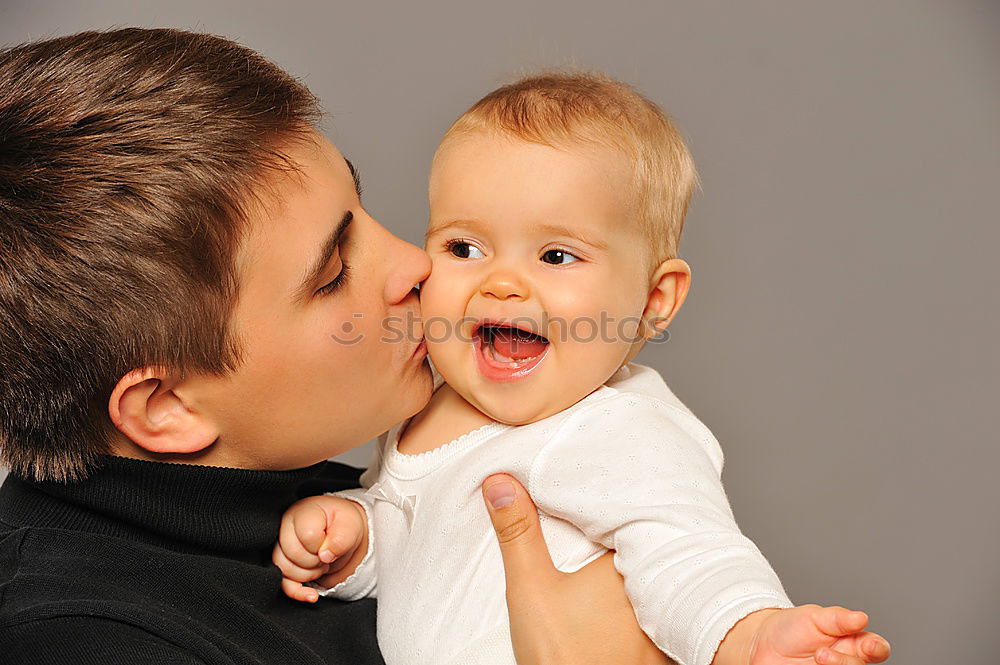 Similar – Image, Stock Photo Father kissing his newborn baby girl.