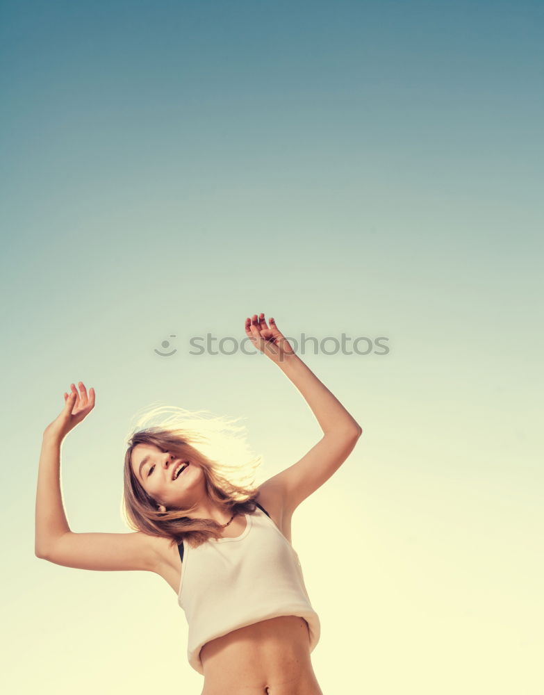 Similar – Young fitnesswoman runner stretching legs after run.