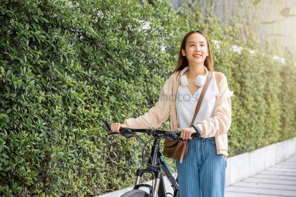 Similar – Image, Stock Photo Black young woman riding a vintage bicycle