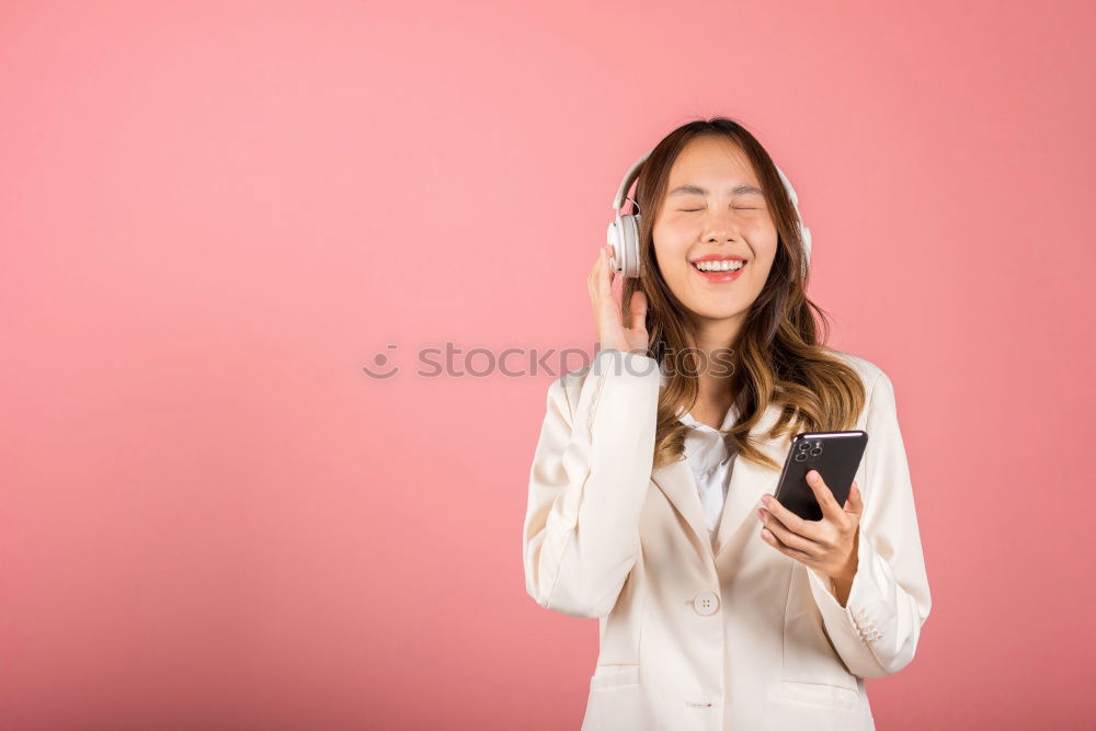 Similar – Happy caucasian women listening to music on smart phone