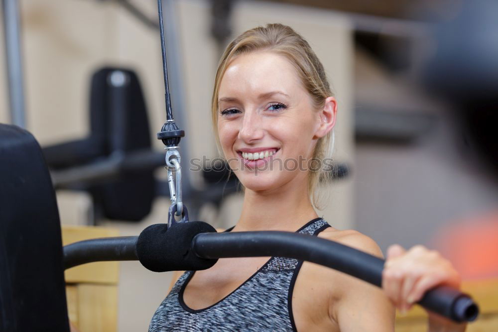 Similar – Athletic woman training in gym