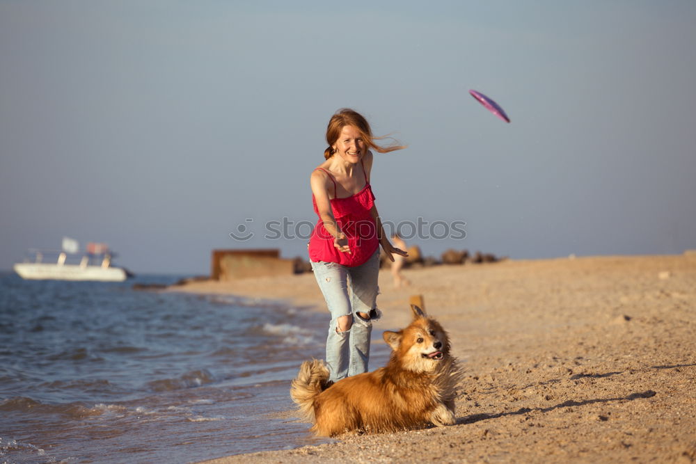 Similar – Image, Stock Photo Woman plays ball throwing with blond Labrador at Baltic Sea beach