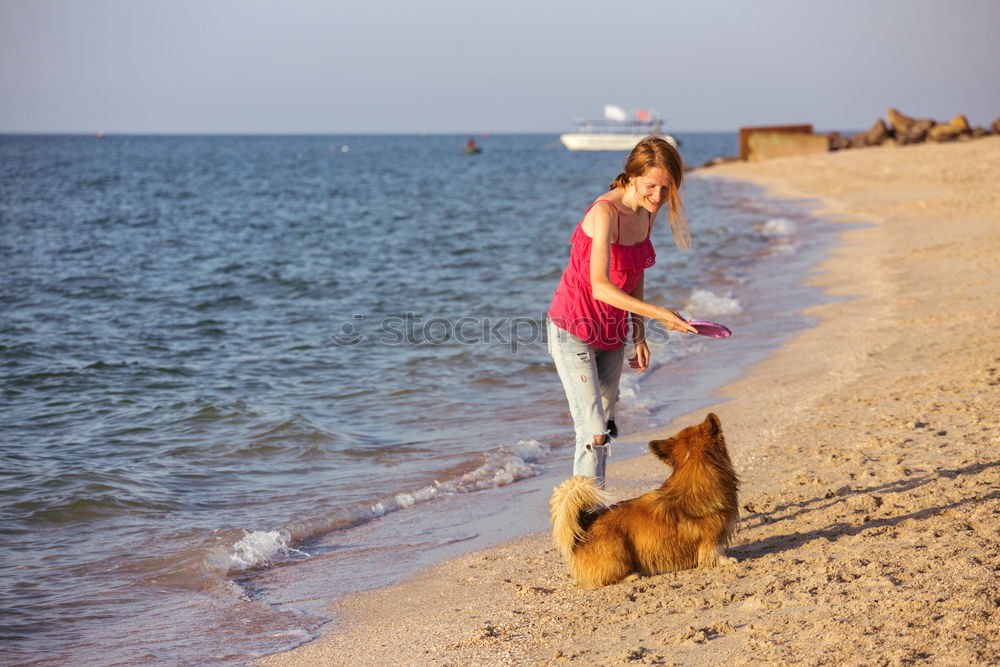 Similar – Image, Stock Photo Woman plays ball throwing with blond Labrador at Baltic Sea beach