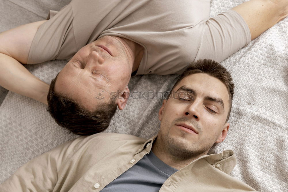 Similar – Gay couple sleeping in each other’s arms.