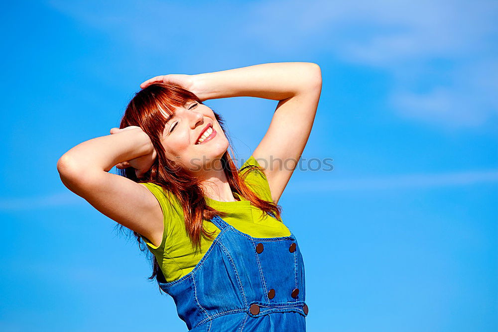 Similar – Cheerful woman in yellow jacket