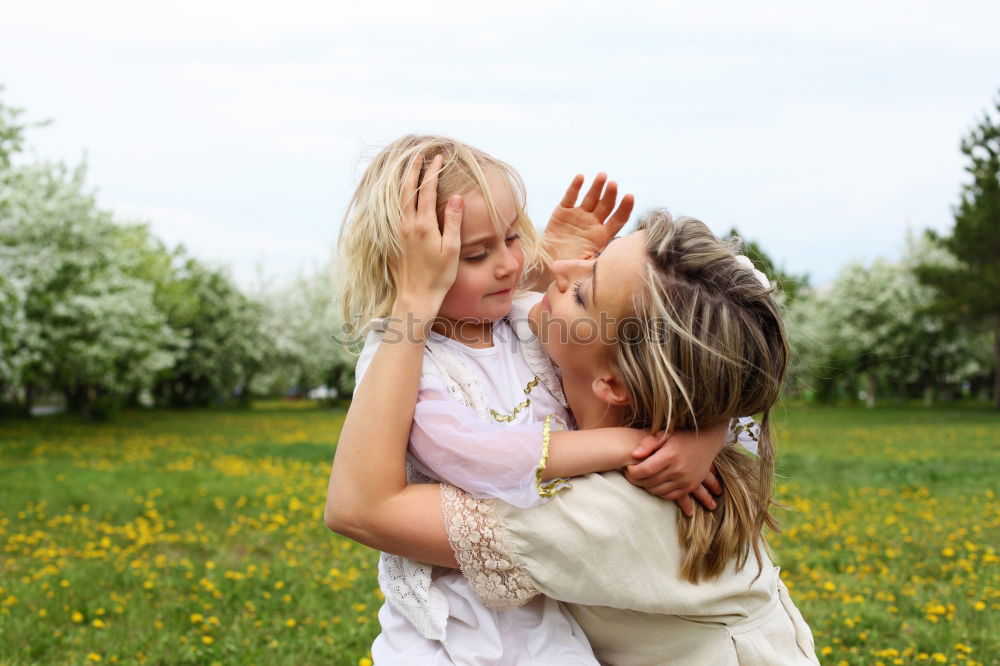 Similar – Two happy girls hugging in urban park.