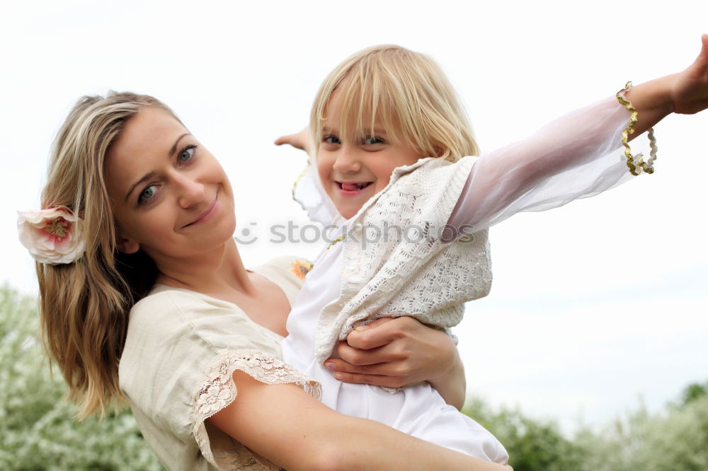 Similar – Image, Stock Photo caucasian mother having his son on her back at the beach